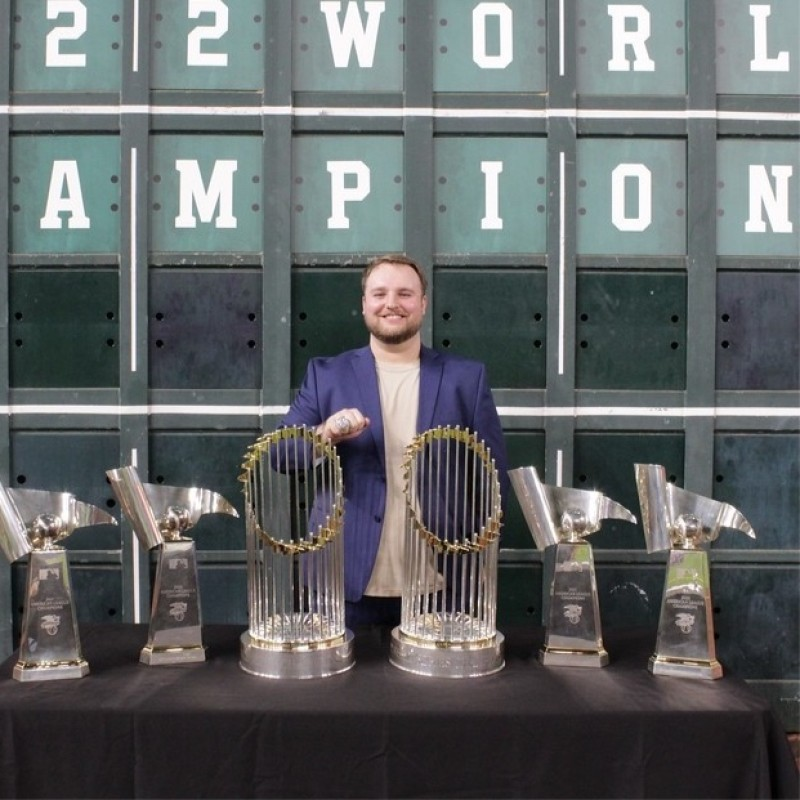Jake Chambers with baseball championship trophies